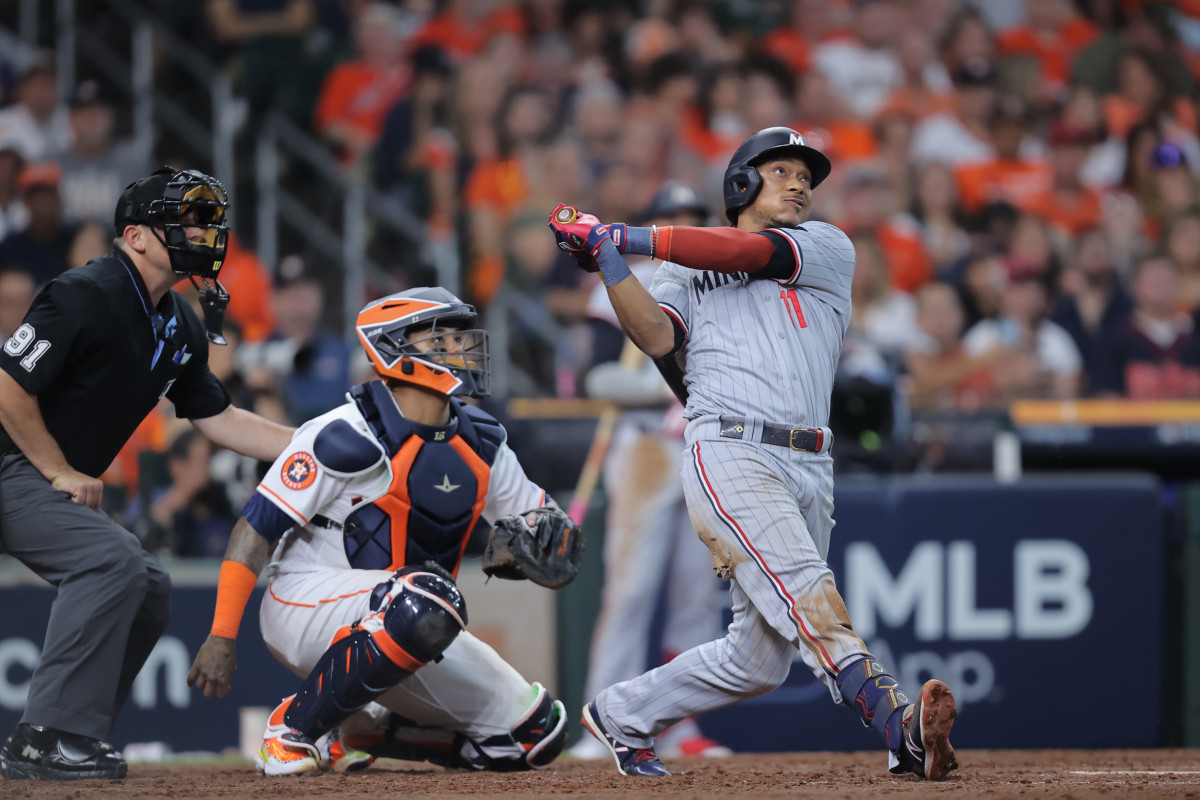 Oct 7, 2023; Houston, Texas, USA; Minnesota Twins second baseman Jorge Polanco (11) hits a three-run home-run in the seventh inning against the Houston Astros during game one of the ALDS for the 2023 MLB playoffs at Minute Maid Park.